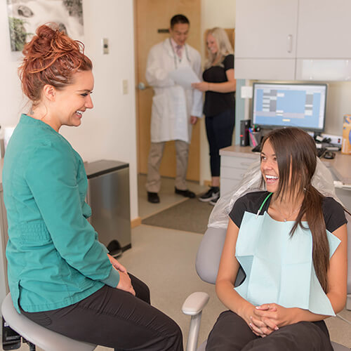 New Patient - Inside Eleven Eleven Dental talking to the assistant