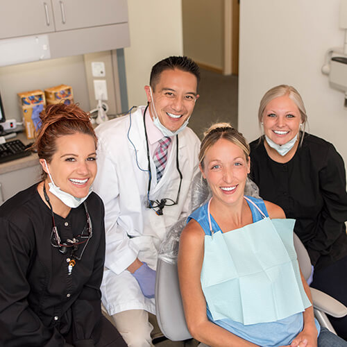 our-team-in-the-dental-office-smiling-with-a-happy-patient in Port Angeles
