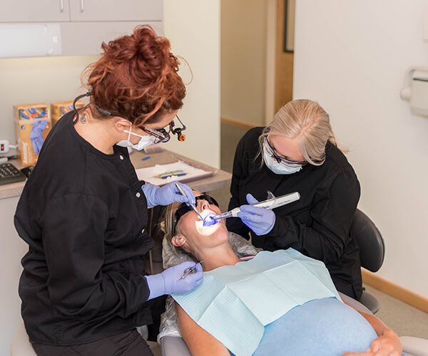 using-a-laser-in-a-patients-mouth by dentist in Port Angeles, WA
